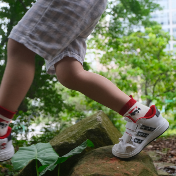 Child wearing Singapore Bus Sock 